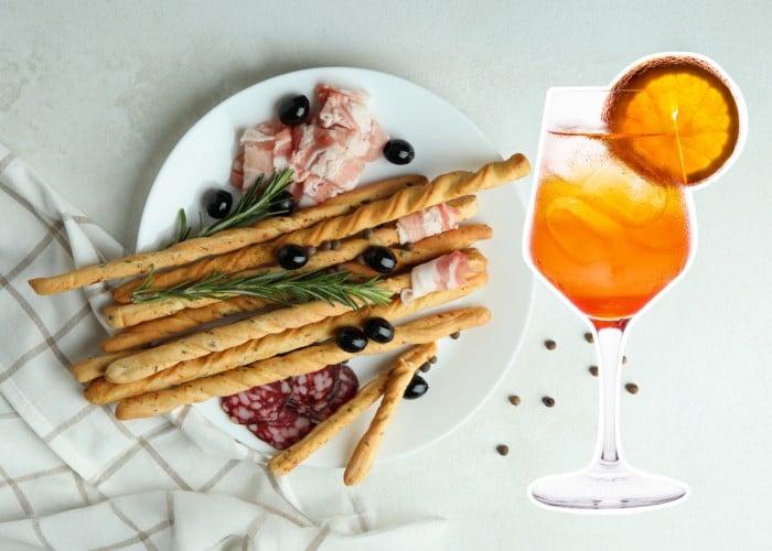 BITTER ORANGE SPRITZ ob spremljavi oliv, grisinov in rezin mortadele