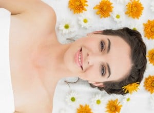 Beauty kiss - woman on white sheet with yellow flowers
