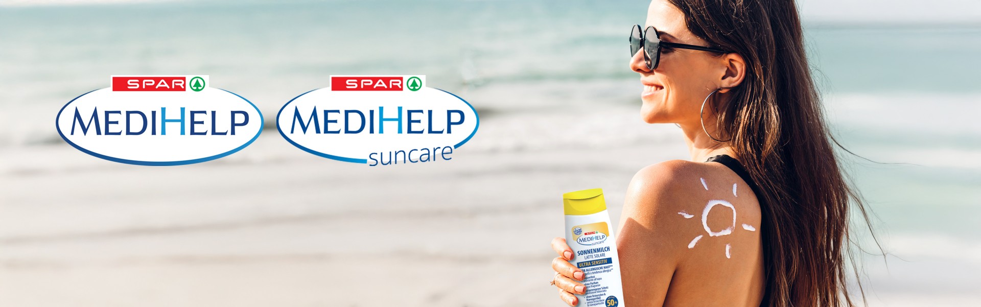 SPAR MEDIHELP in SPAR MEDIHELP suncare SPAR MEDIHELP in SPAR MEDIHELP suncare, ženska ob morju s kremo SPAR MEDIHELP suncare kremo v rokah