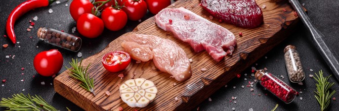 Fresh juicy steak of beef, pork and chicken with vegetables ready to cook
